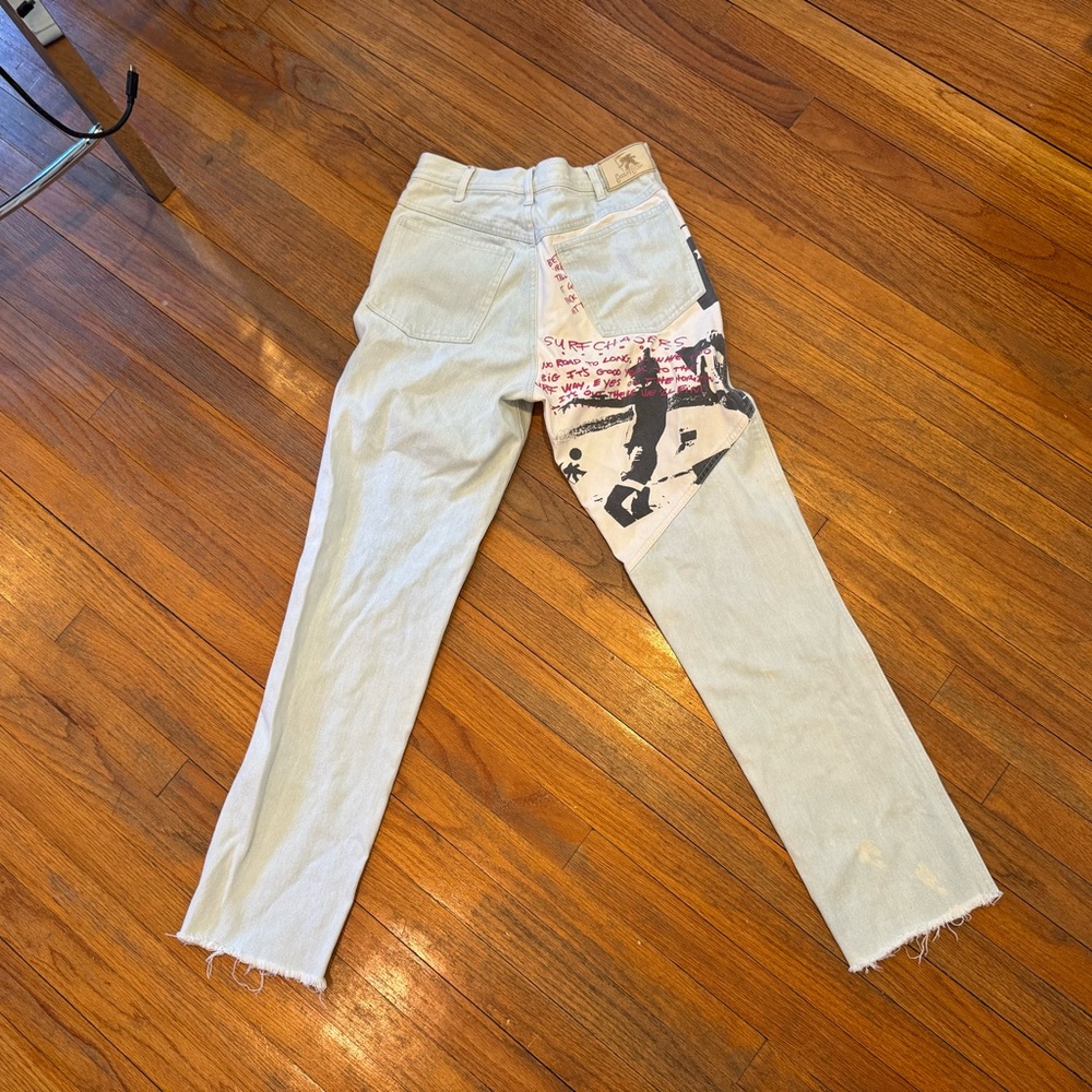 Vintage style light washed denim with graphic on the back